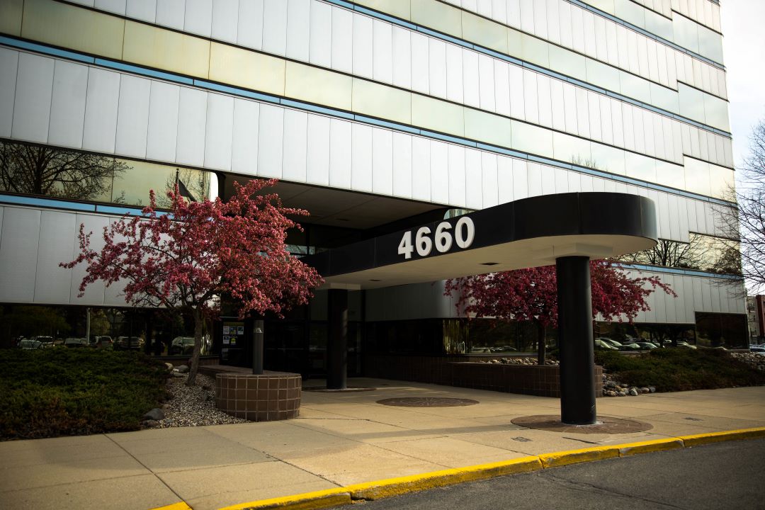 Front door of 4660 S Hagadorn Building